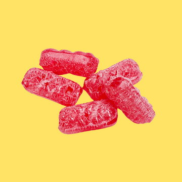 Five pieces of red, translucent, textured gummy candy arranged in a cluster on a solid yellow background.