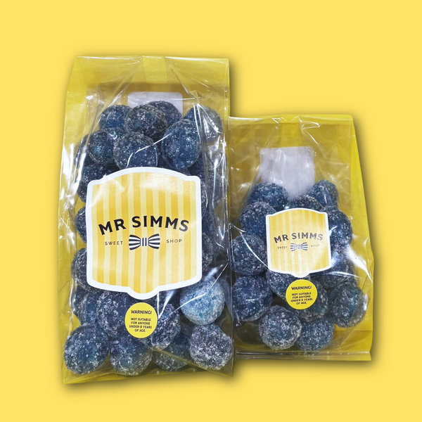 Two packages of blue gummy bears with 'Mr Simms' labels on a yellow background