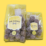 Two packages of Mr Simms sweet shop treats on a yellow background