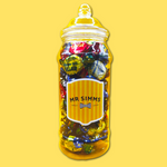 Jar of colorful candies with 'Mr Simms' label on a yellow background