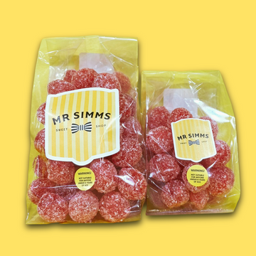 Two packages of red gummy bears with 'Mr Simms' labels on a yellow background