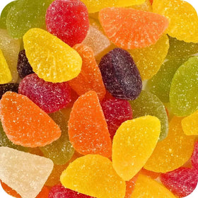 Assorted colorful gummy candies on a white background