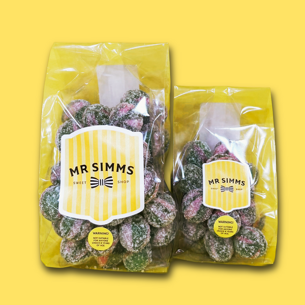 Two packages of Mr Simms sweets on a yellow background